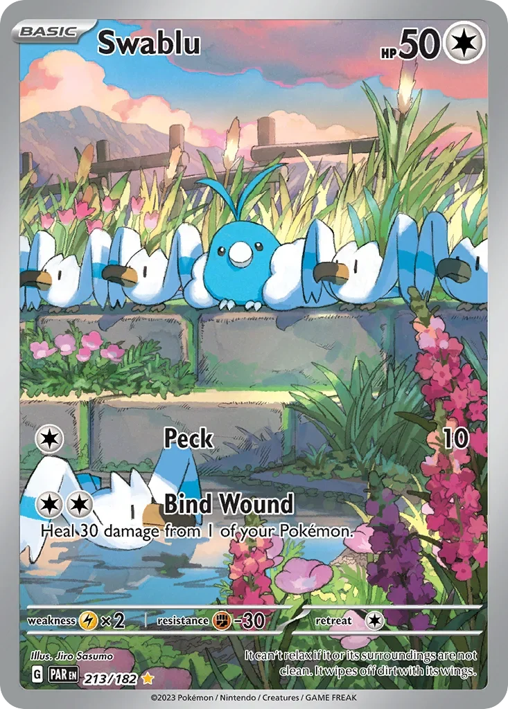 A Pokémon card features Swablu, a blue and white bird with fluffy wings, perched on a stone ledge surrounded by pink and purple flowers and green plants, with a background of mountains and a colorful sky.