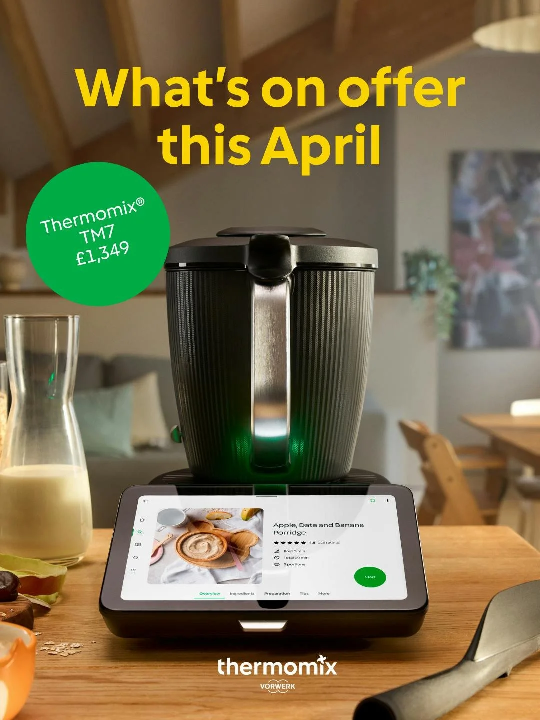 A Thermomix TM7 kitchen appliance on a wooden table, with a tablet showing a cookidoo recipe for apple, date, and banana porridge, and a pitcher of milk nearby.