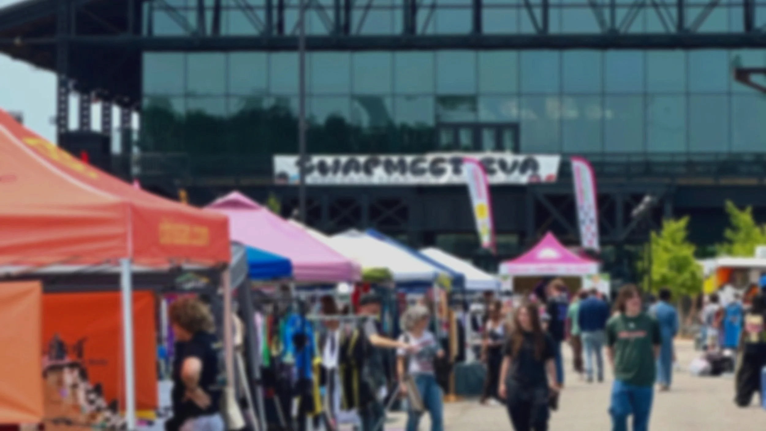Blurred view of grocery store shelves stocked with various bottles and containers.