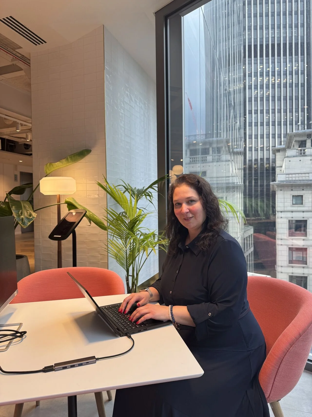 Life Mentor Global founder working in a modern office, by the laptop, focused on strategic alignment and executive work.