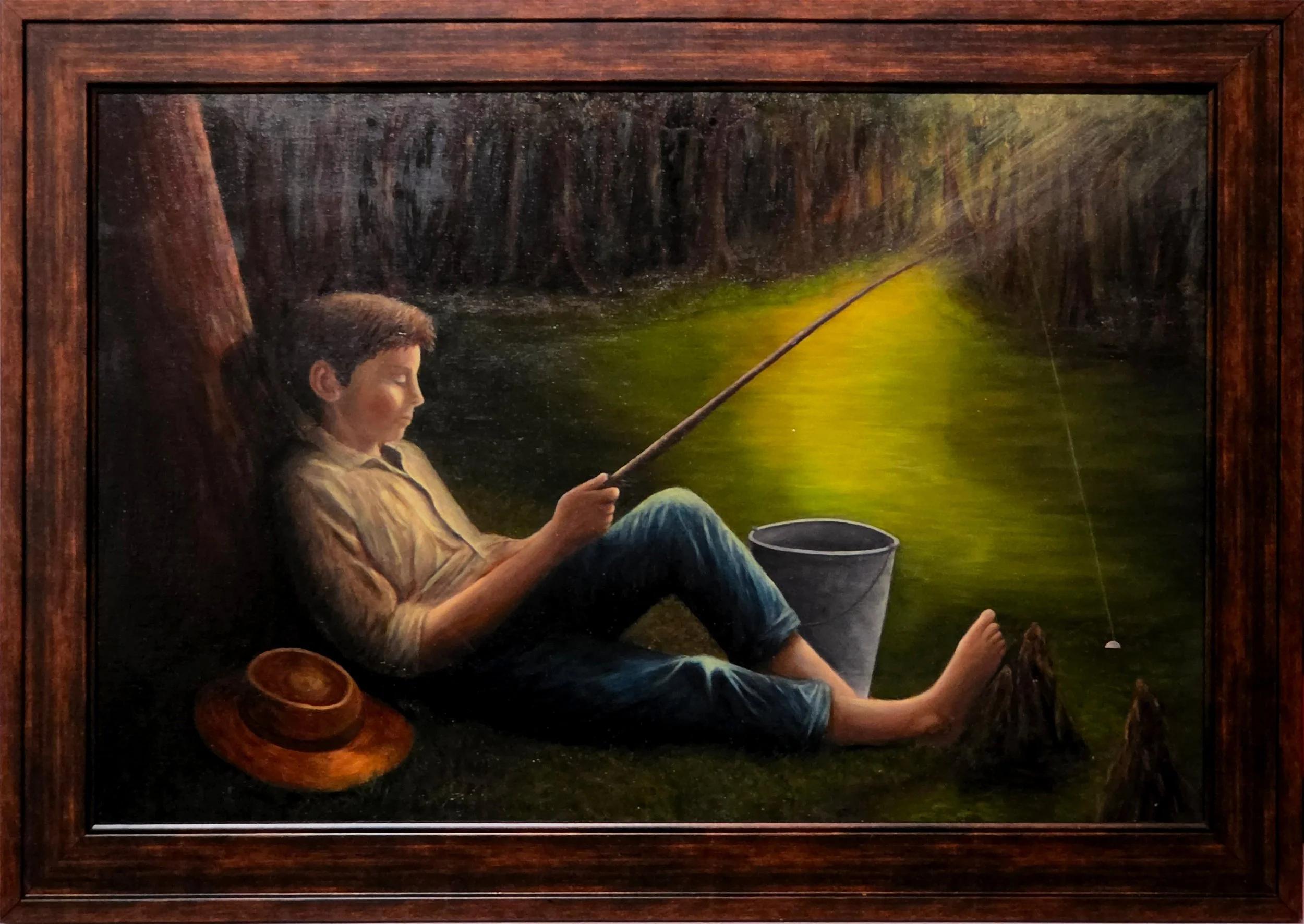 A realistic painting of a boy sitting by a river, fishing with a rod. He has short dark hair, wearing a light-colored shirt and blue jeans. His hat lies on the ground beside him. The river and surrounding woods are depicted in natural colors, with the boy in a relaxed posture, surrounded by nature.