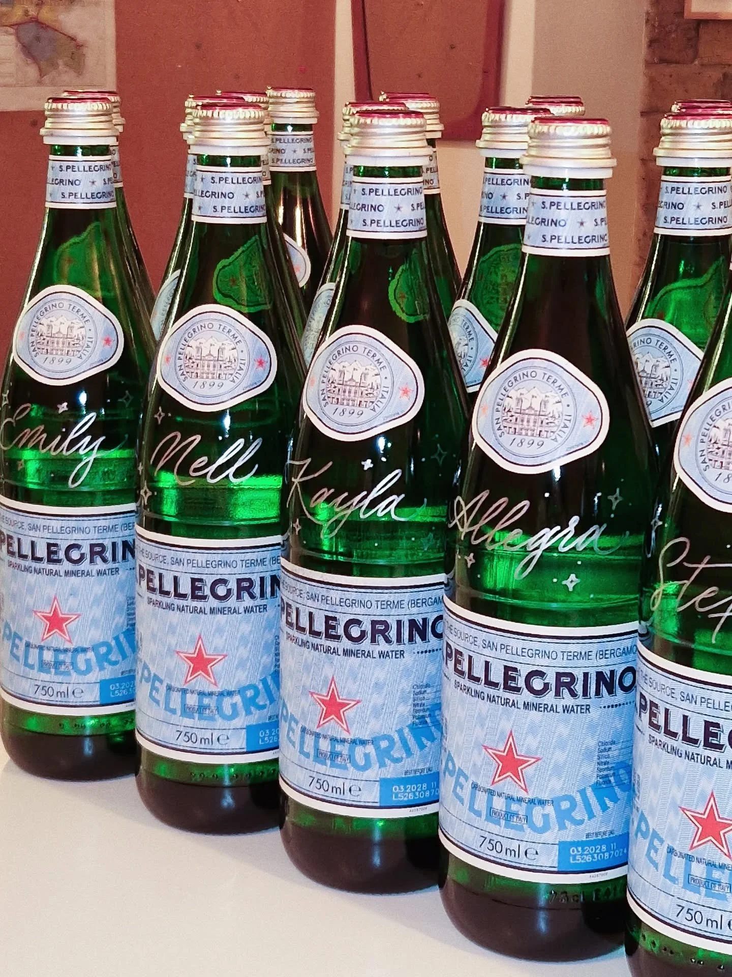 Supper club with @sanpellegrino_uk. A cosy night with a dash of sparkle ✨ Guests left with personalised bottles for themselves and their loved ones. Such a pleasure to add calligraphy to these lovely bottles and place cards. 

#calligraphy #brandacti