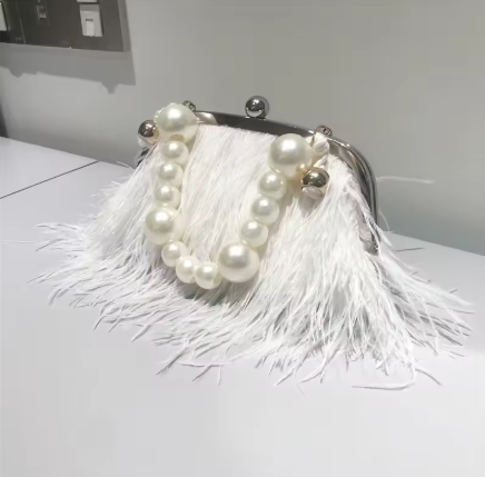 white pearl handle handbag.png