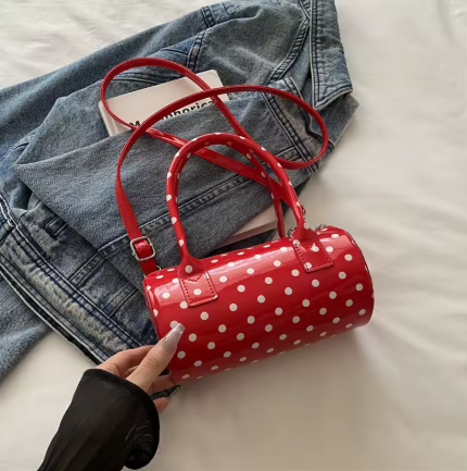 red and white polka dot handbag.png