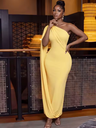 yellow one shoulder dress.png