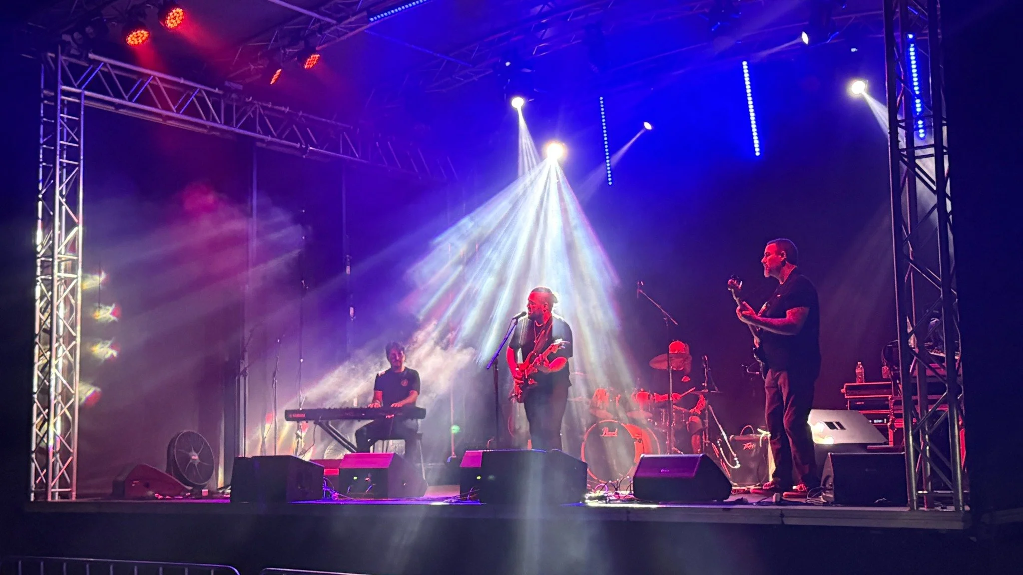 The Adam Ruthless Band performing on stage at Riverside Rhythms Festival in Kempsey