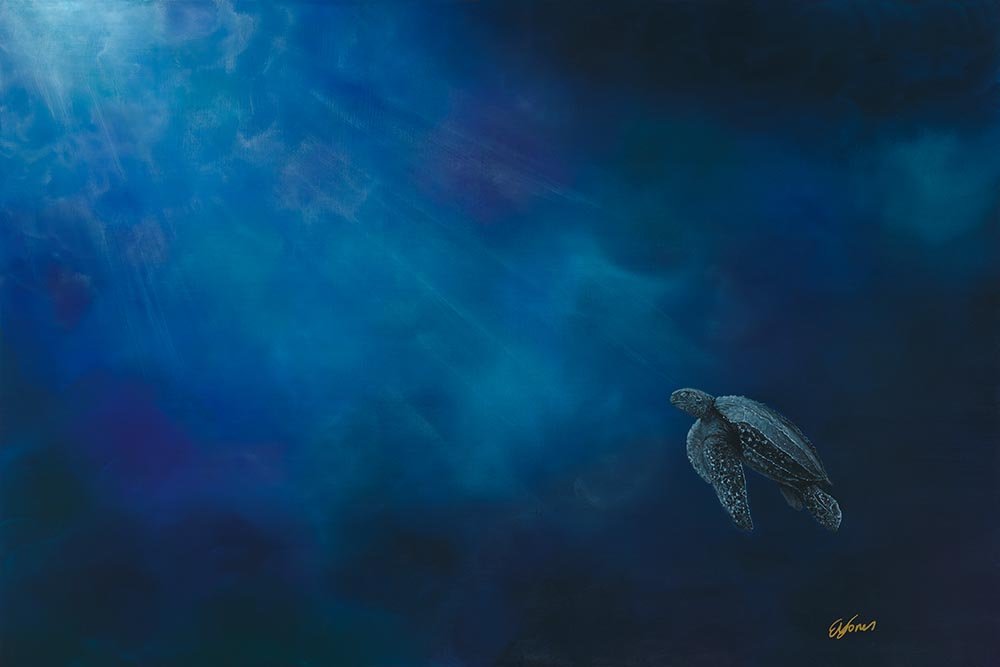 A sea turtle swimming in deep blue ocean water with light rays filtering down from above.