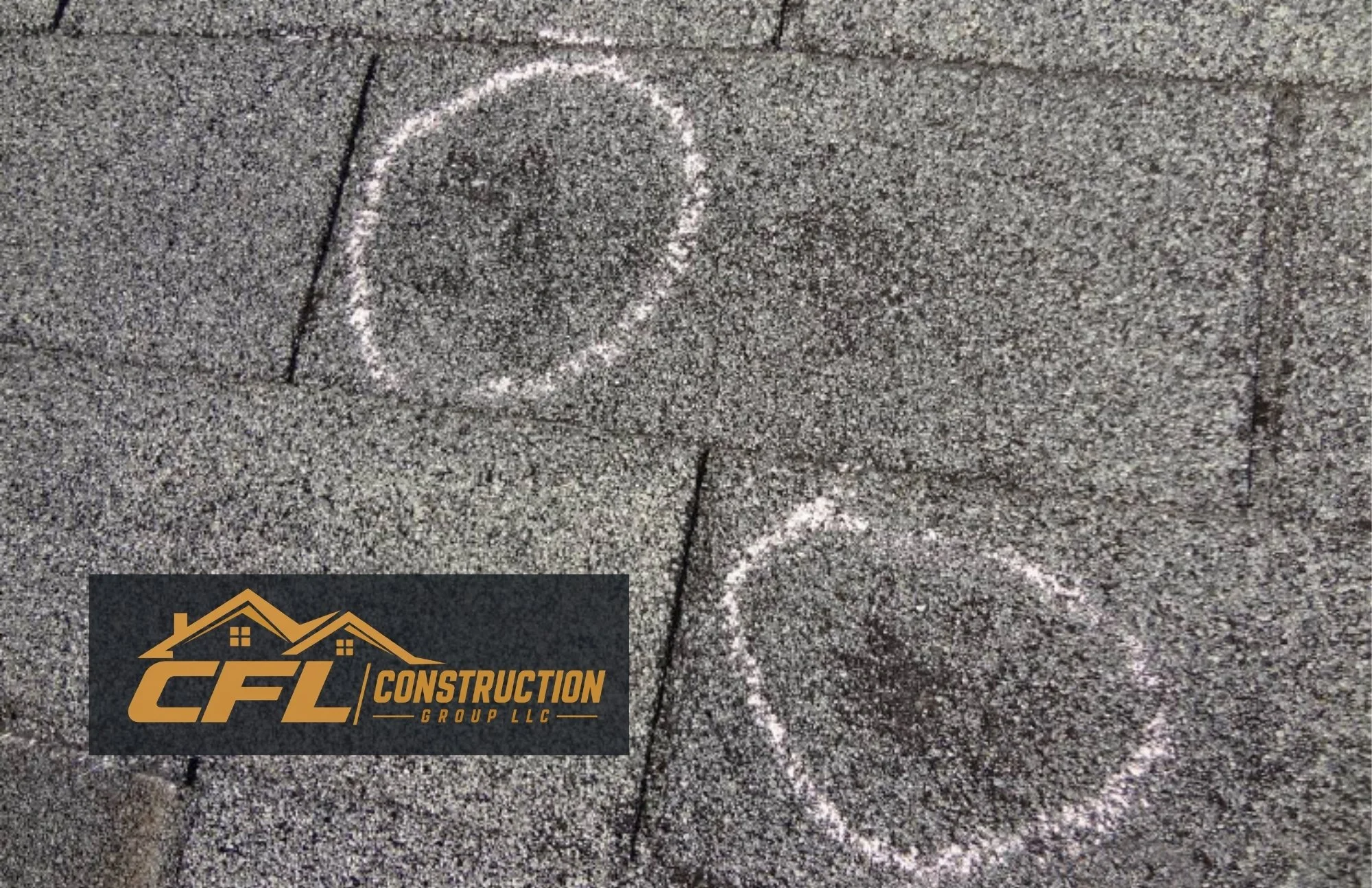 Hail impact damage on residential asphalt roof shingles