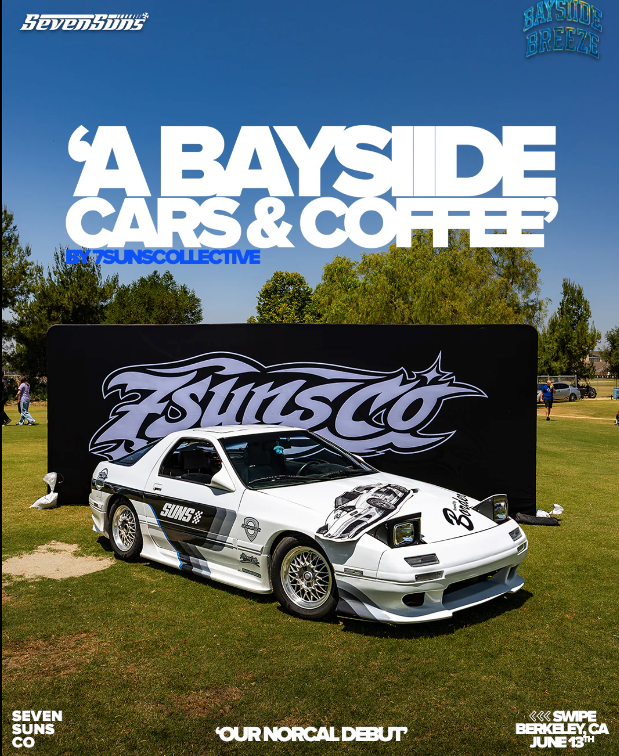 A vintage white sports car with decals and racing graphics displayed on grass at an outdoor event, with a black backdrop featuring the 'Funsco' logo, and promotional signs for 'A Bayside Cars & Coffee' event on June 13th in Berkeley, California.