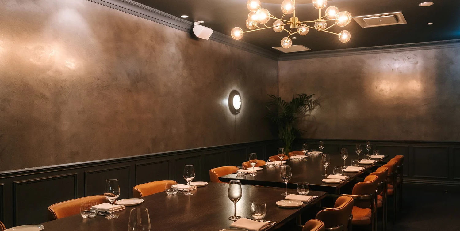 Private Dining Room 3 at Blackbird Melbourne, the plaster wall and brass chandelier