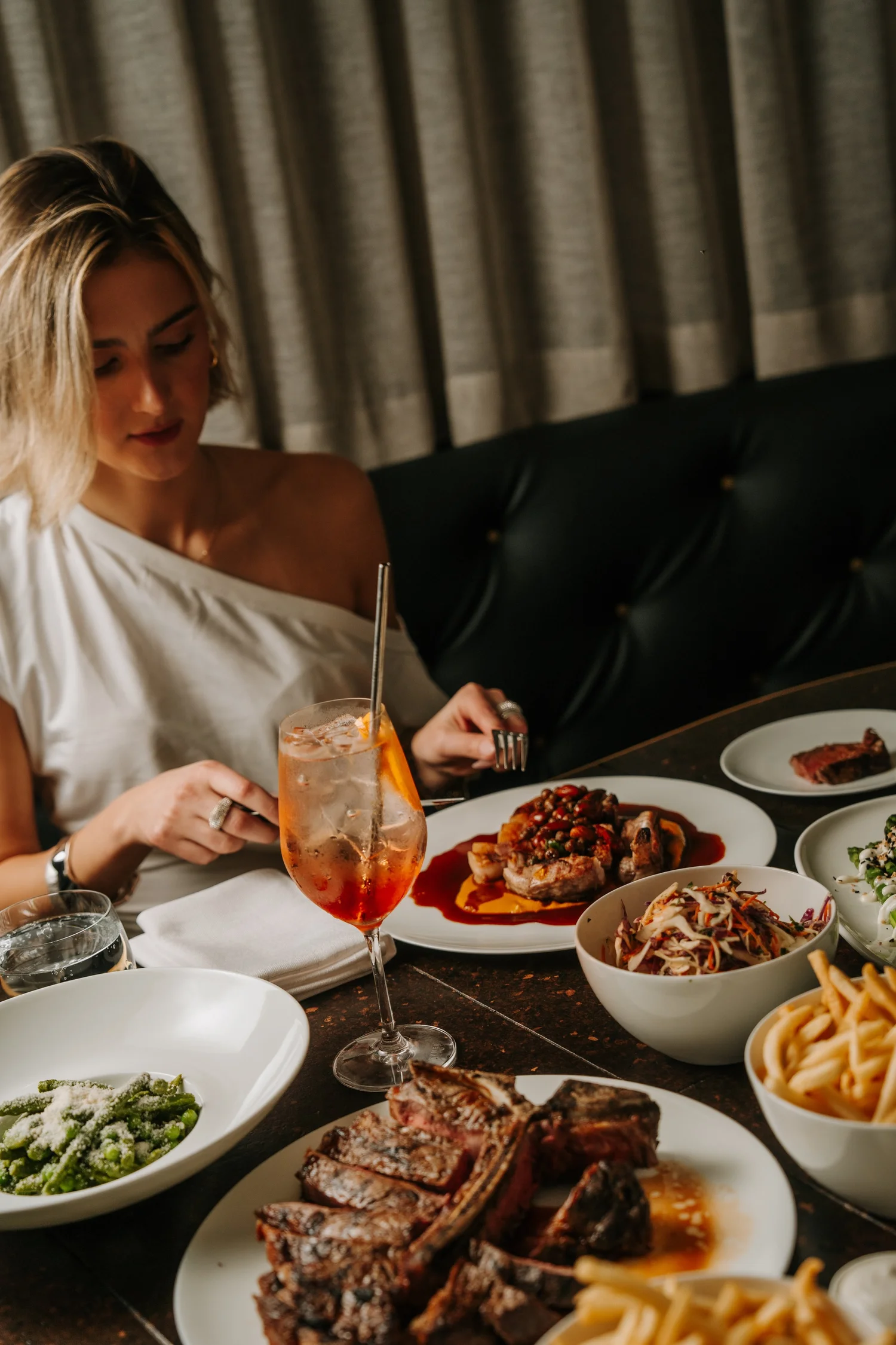 A guest at a seated Christmas dinner table at Blackbird Melbourne