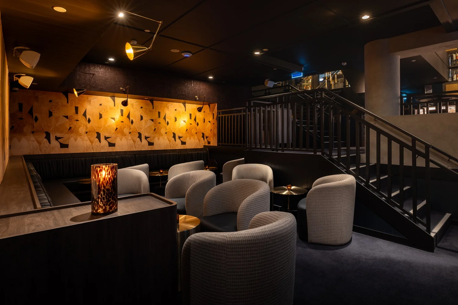 The Flinders Sunken Lounge at Blackbird Melbourne, low armchairs beneath a gilded patterned wall