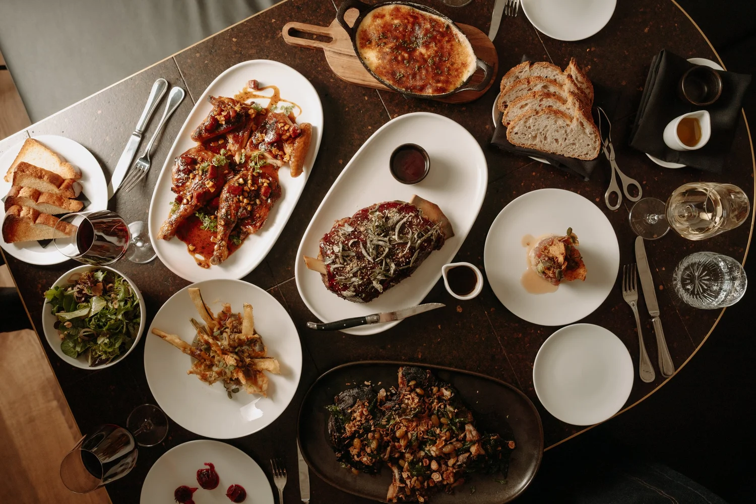 Table spread with several shared dishes from the Blackbird Melbourne feasting menu