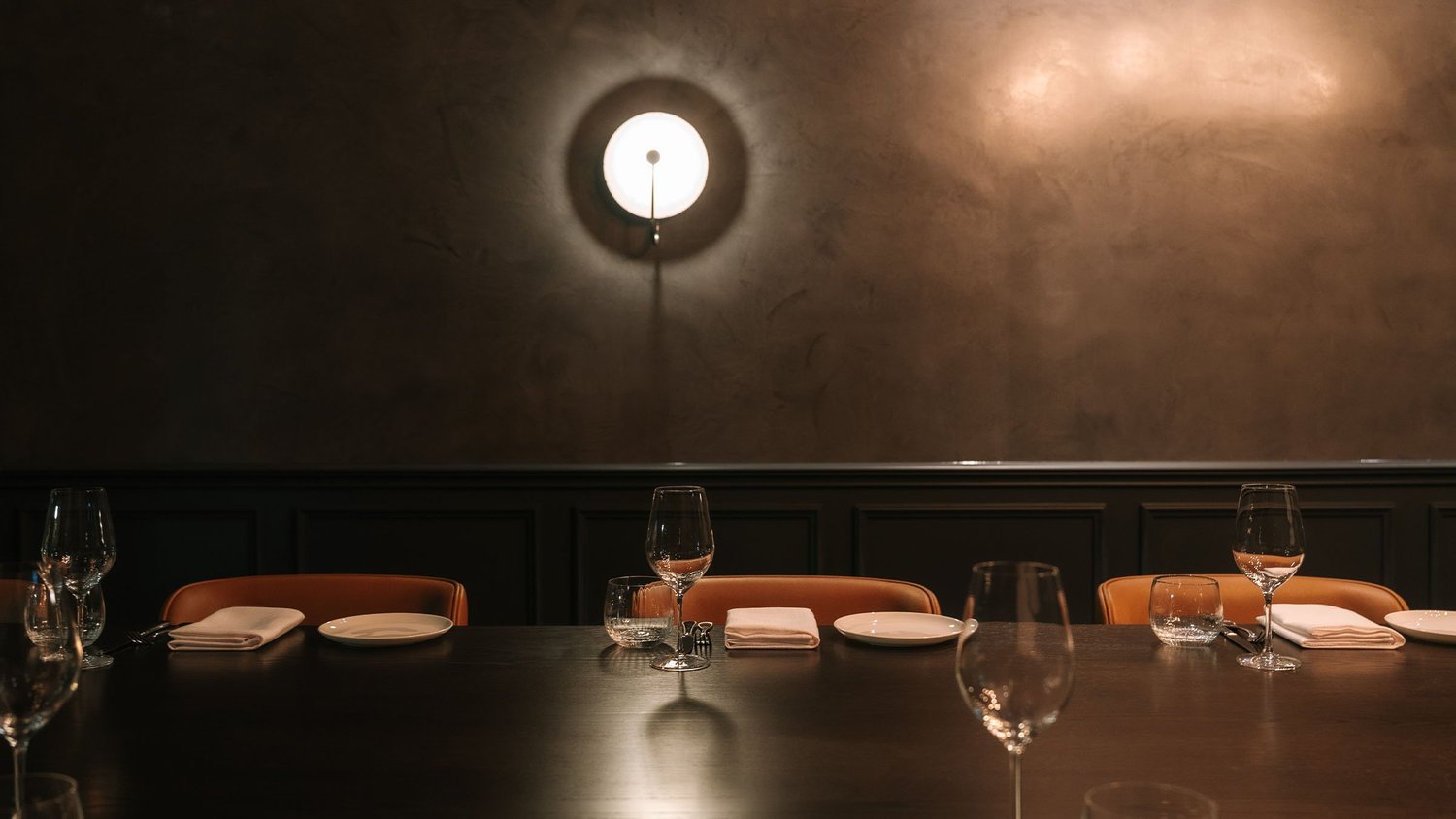 Private Dining Room 2 at Blackbird Melbourne, a closer view of the table setting beneath the wall sconce