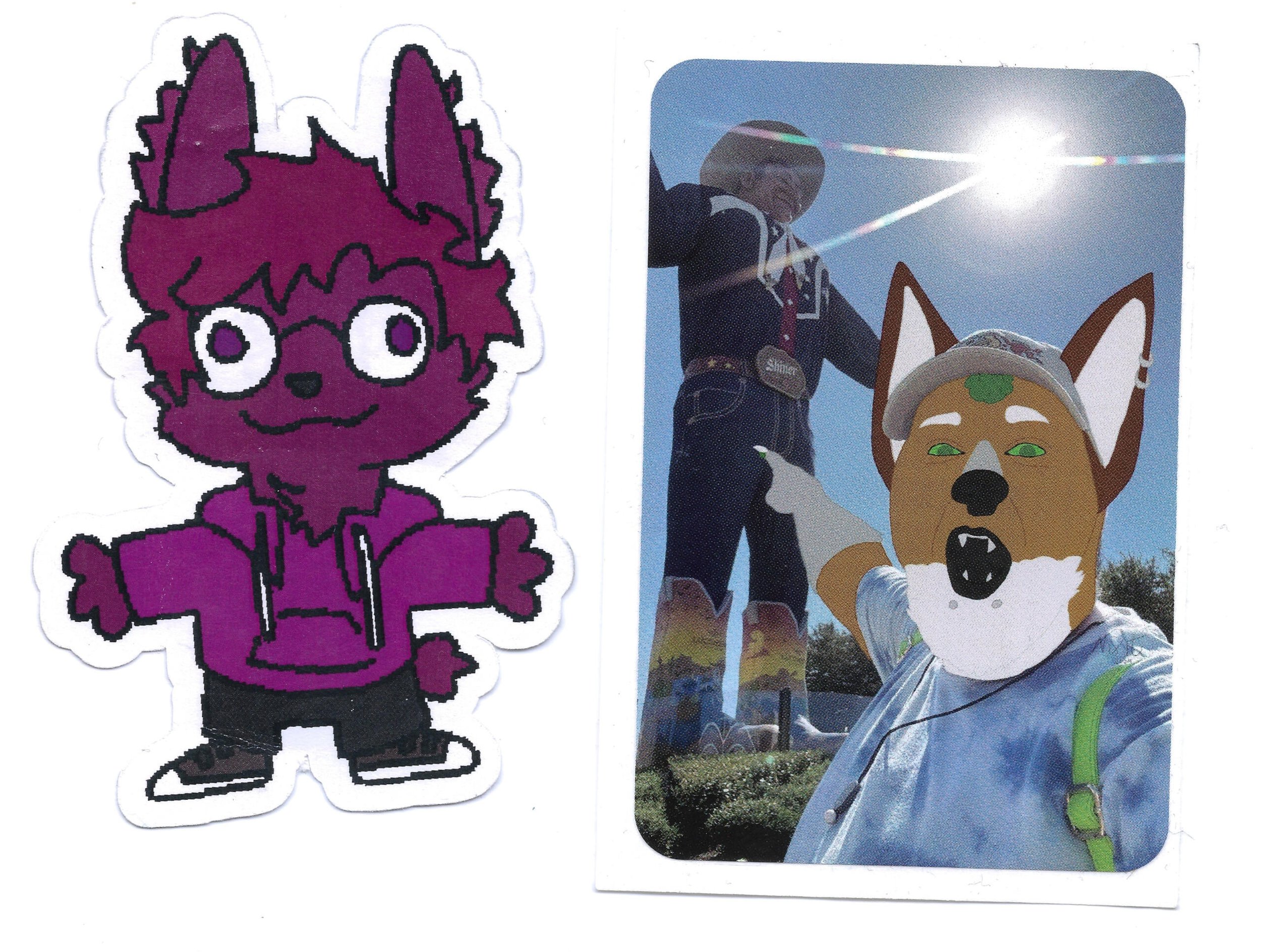 A cartoon sticker of a purple anthropomorphic fox with large ears, white eyes, and a friendly smile, wearing a purple hoodie and black pants. A photograph of a person in a dark costume with a large fox mask with green eyes, pointy ears, and open mouth with sharp teeth, standing outdoors under a bright sun in a costume that appears inspired by a fox or wolf, with other costume details and clear blue sky in the background.