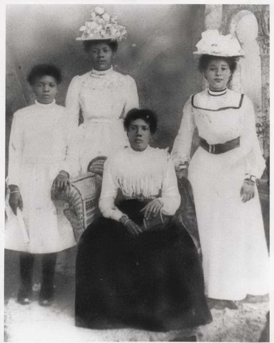 A family photograph from rural Manchester parish, Jamaica, taken in the late Edwardian period (c.1908&ndash;1911).

Seated is Margaret Drummond, with her daughters and close family. Standing on the right is Antoinette Adeline Dwyer (b.1884). The youn