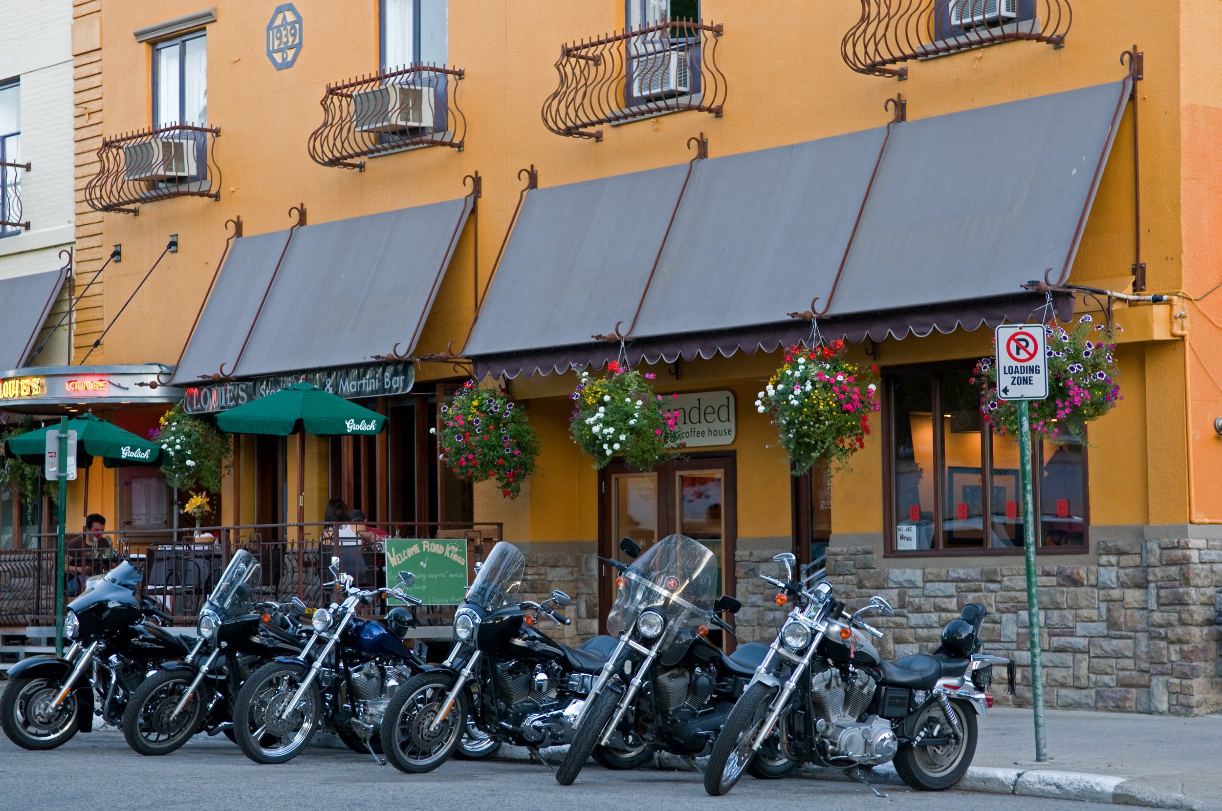 Row of motorcycles parked outside of hotel in Nelson BC, photo by Phil Best