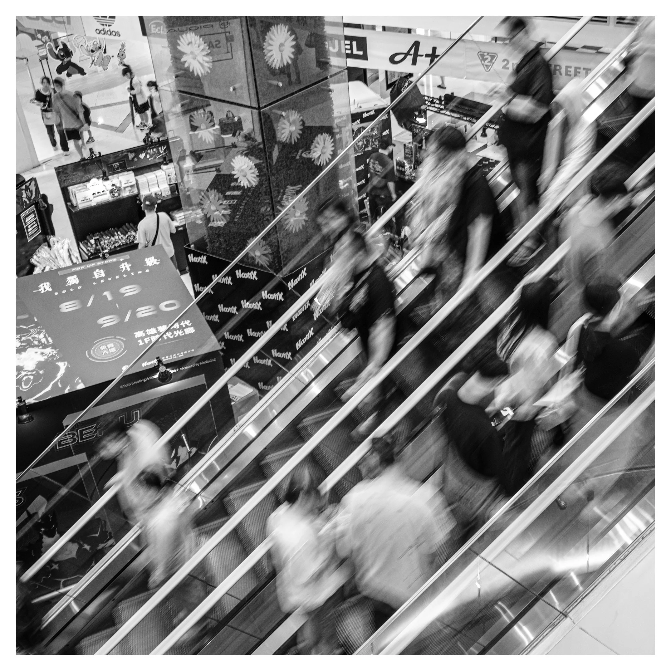 Day 312/365 Rush Hour Ghosts: Diagonals and Dissolve in a Kaohsiung Shopping Mall