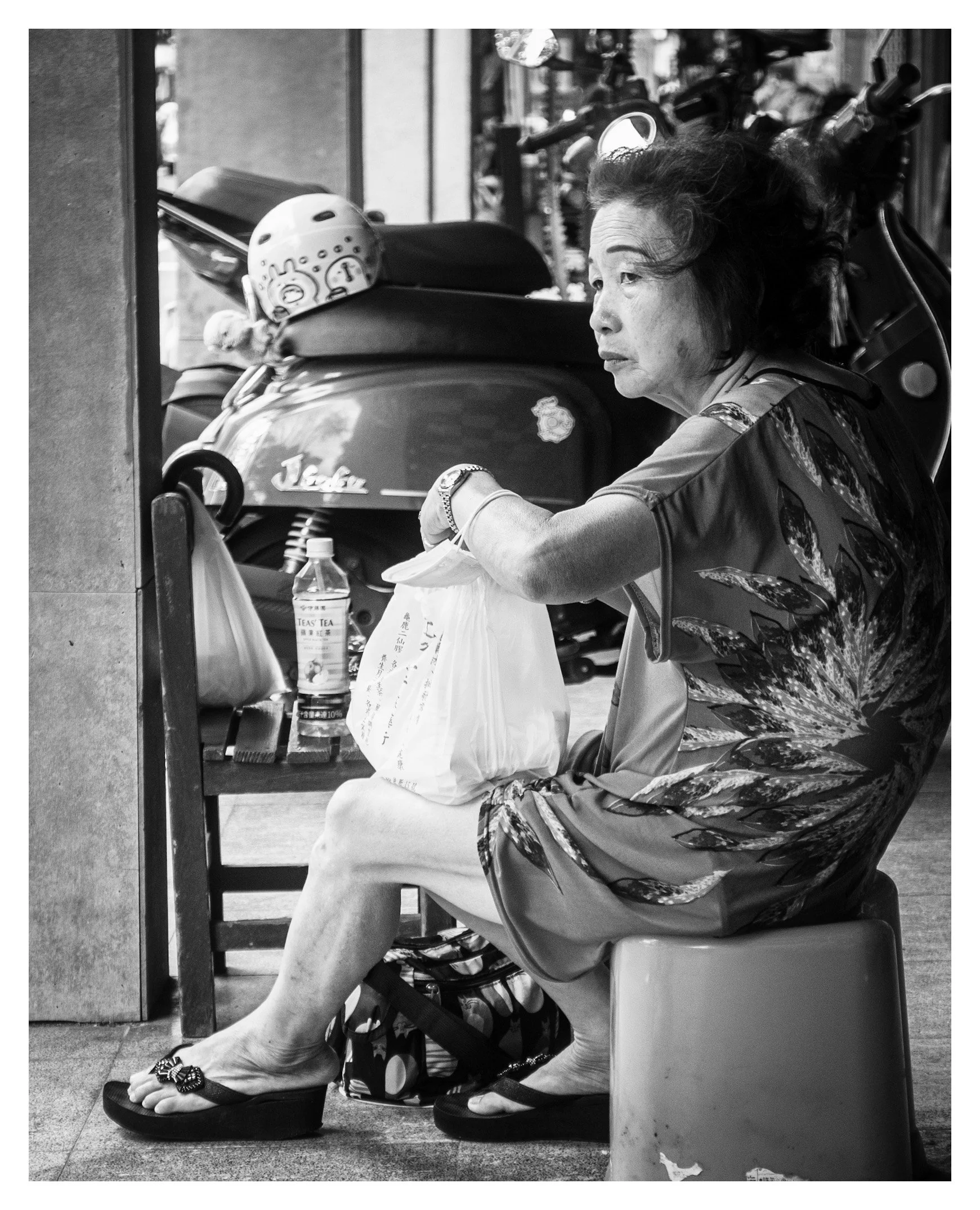 Day 313/365 The Weight of a Plastic Bag: A Portrait of Patience on a Tainan Porch