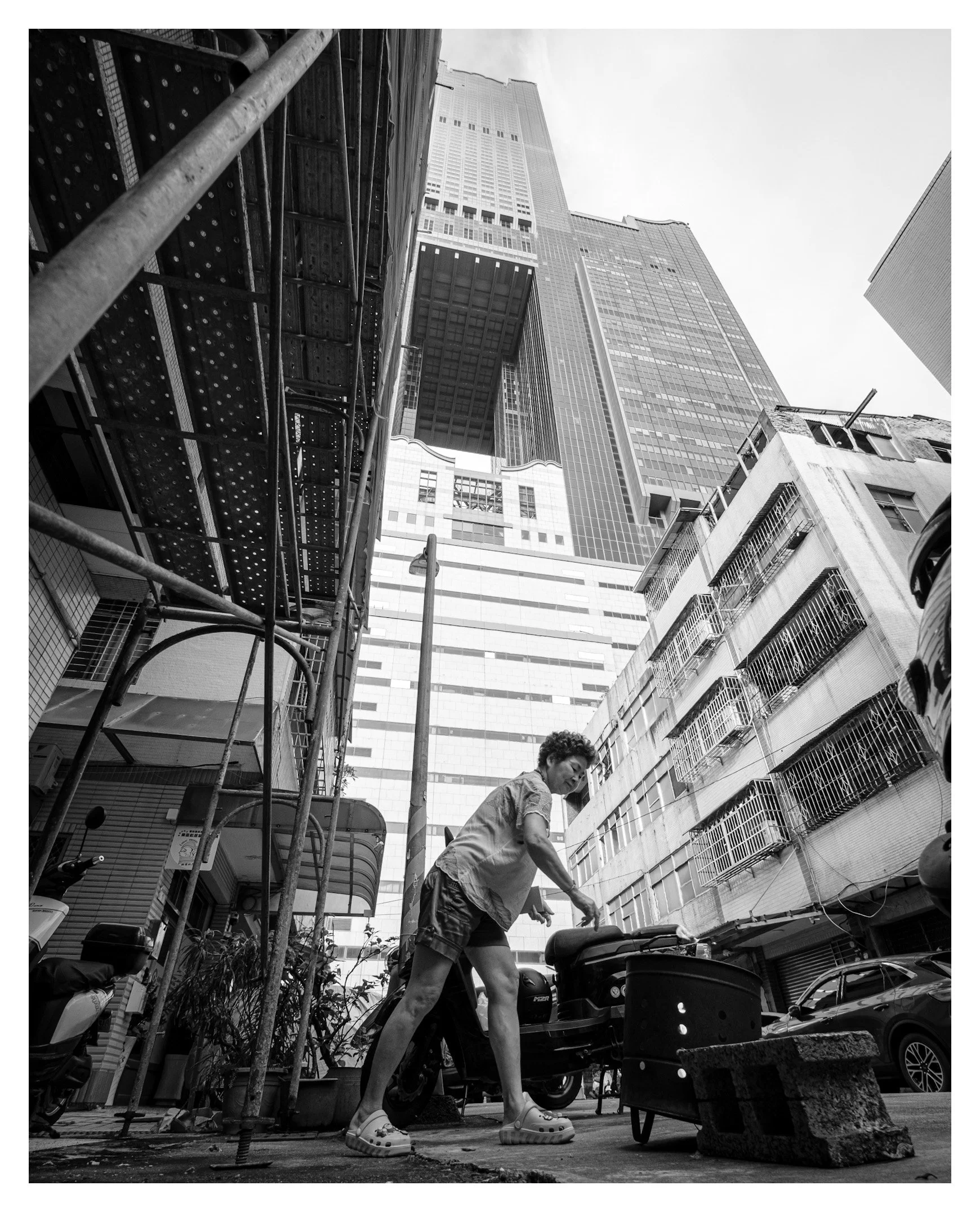 Day 311/365 Smoke and Steel: Burning Paper Money in the Shadow of Kaohsiung's Rising Tower