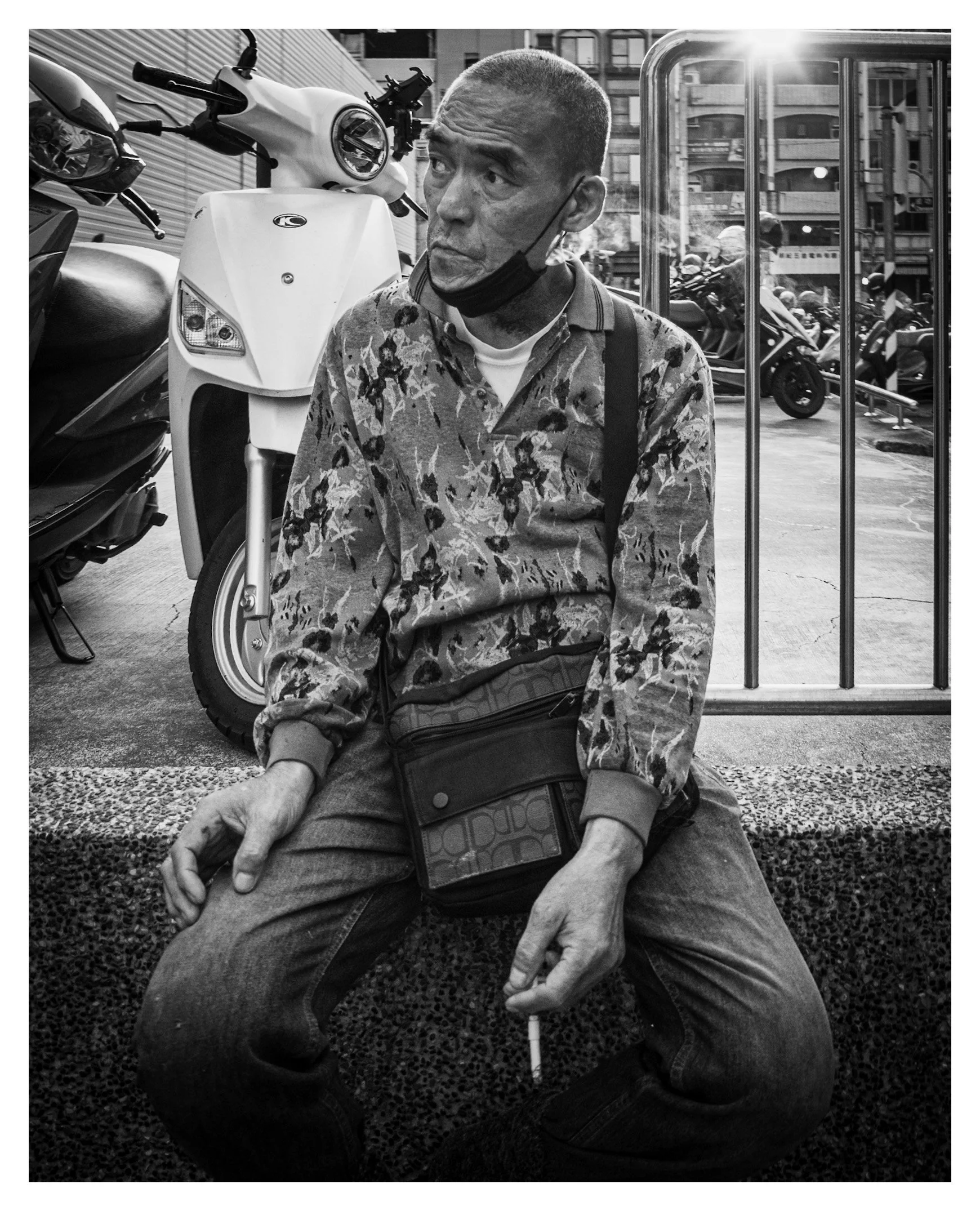 Day 353/365 The Sidelong Glance: A Seated Portrait Among the Scooters