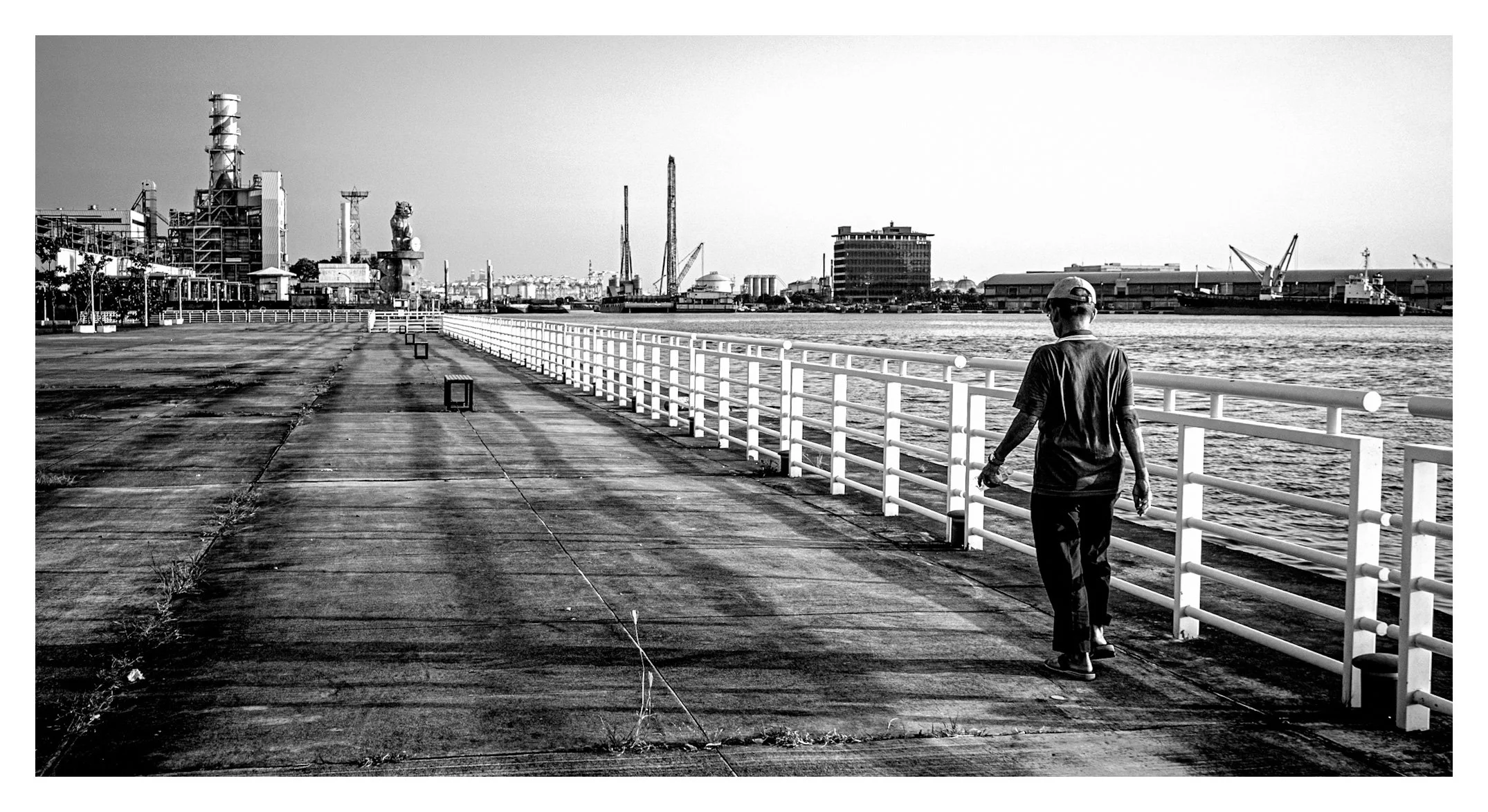 Day 344/365 Walking the Line: A Solitary Figure Against Kaohsiung's Industrial Edge