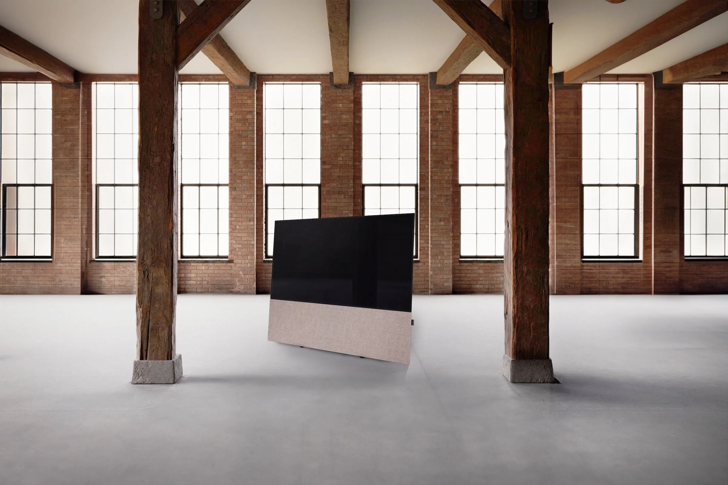 CANVAS HIFI Soundbar in Structur Gray unter einem TV montiert, freistehend in einem Loft