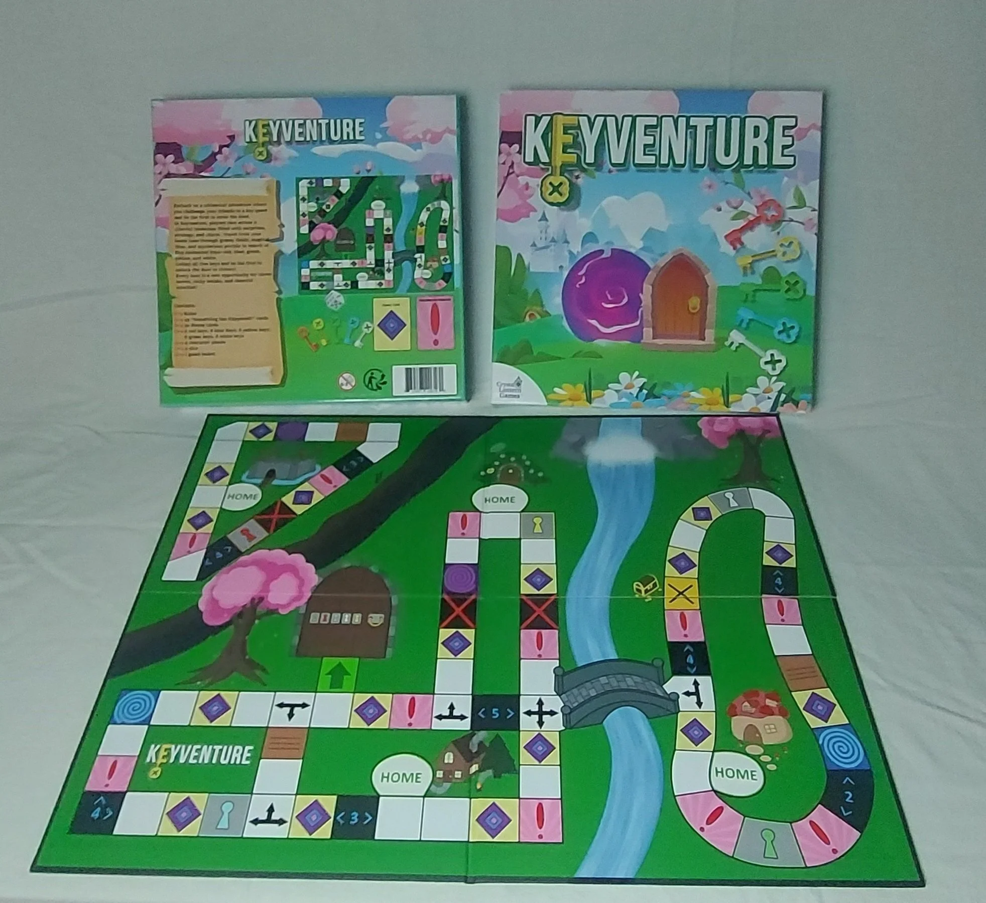 Colorful board game box back and front titled 'Keyventure' with the game board set on a white surface.