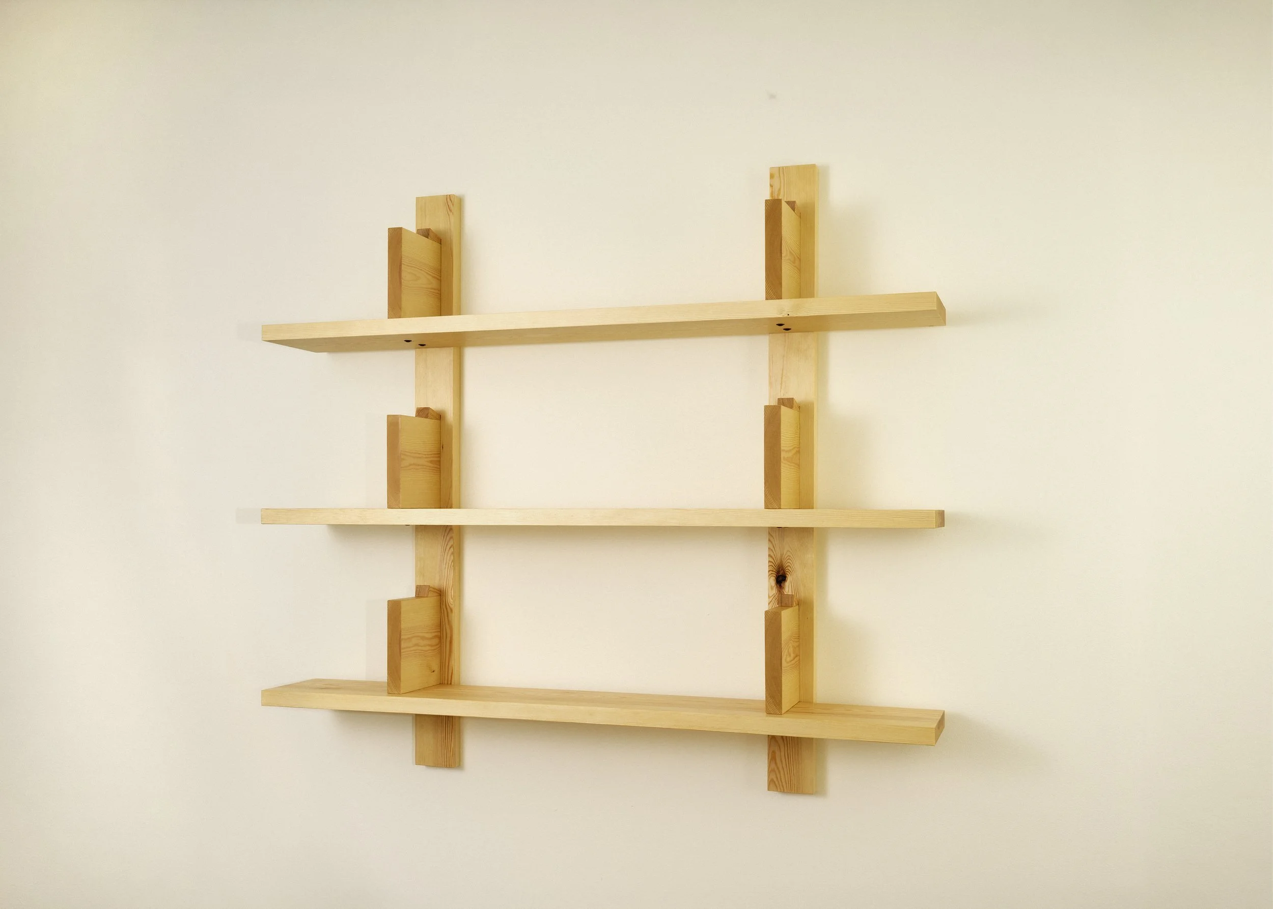 Simple solid pine wall shelving unit in Japanese bauhaus style.