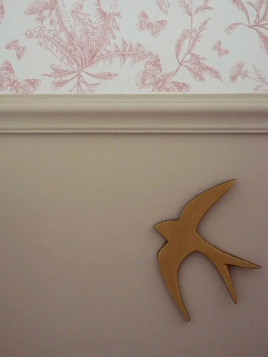 Toile de Jouy Wallpaper for a bedroom with paneling & a gold brass bird