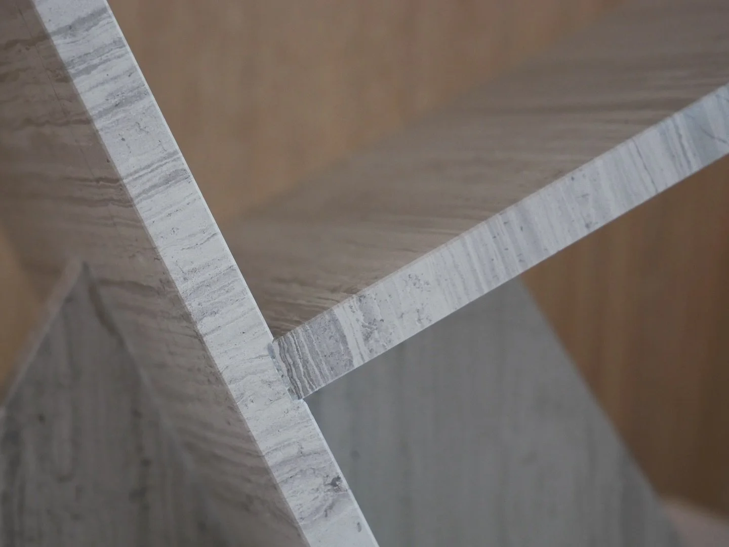 An exceptional way to showcase coffee table books or magazines with a sculpture made in travertine stone which adds a touch of geometric elegance to a home. Designed by Tina Schmidt for Woud. Tina is a Danish designer who captures the beauty of mount