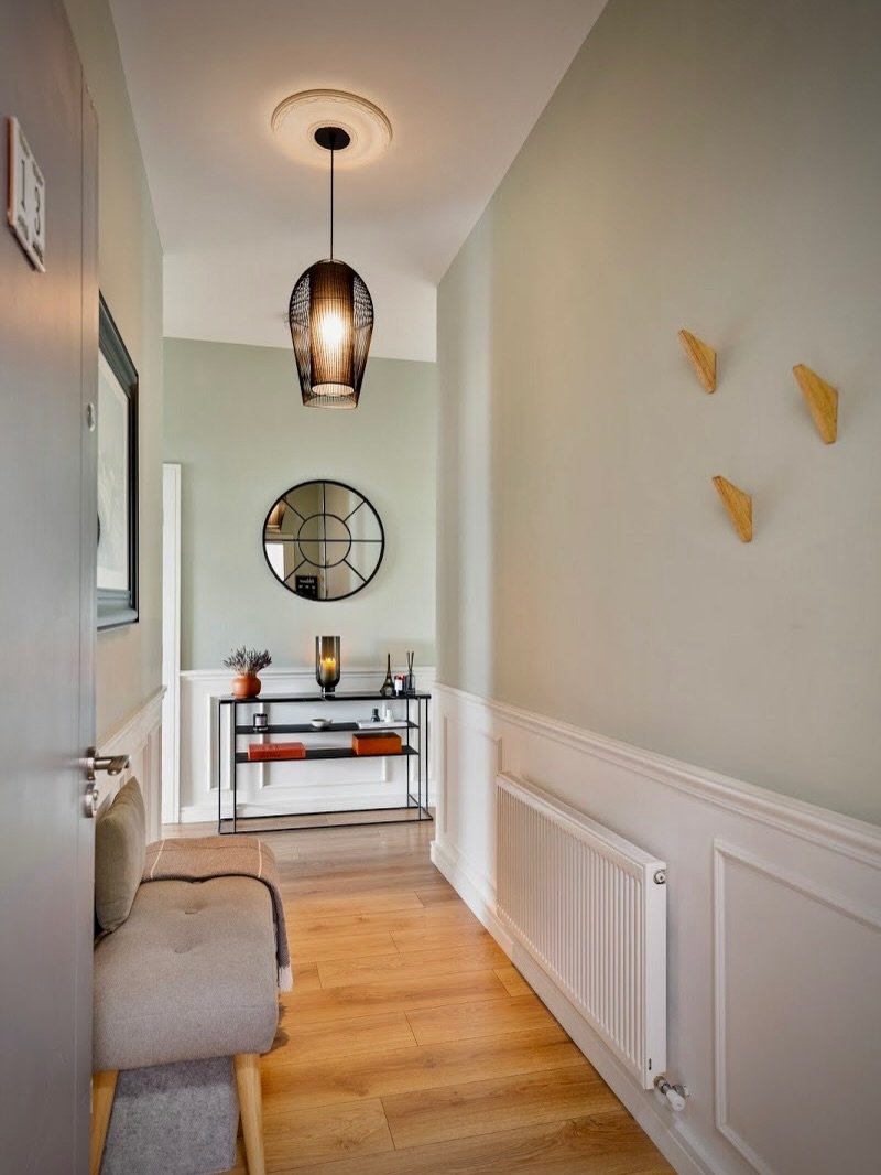 A dramatic hallway transformation. The task was to take a recently constructed space with no distinct identity and infuse it with charm and emotional resonance. Achieved by blending refined Parisian sophistication with Nordic aesthetic to evoke a sen