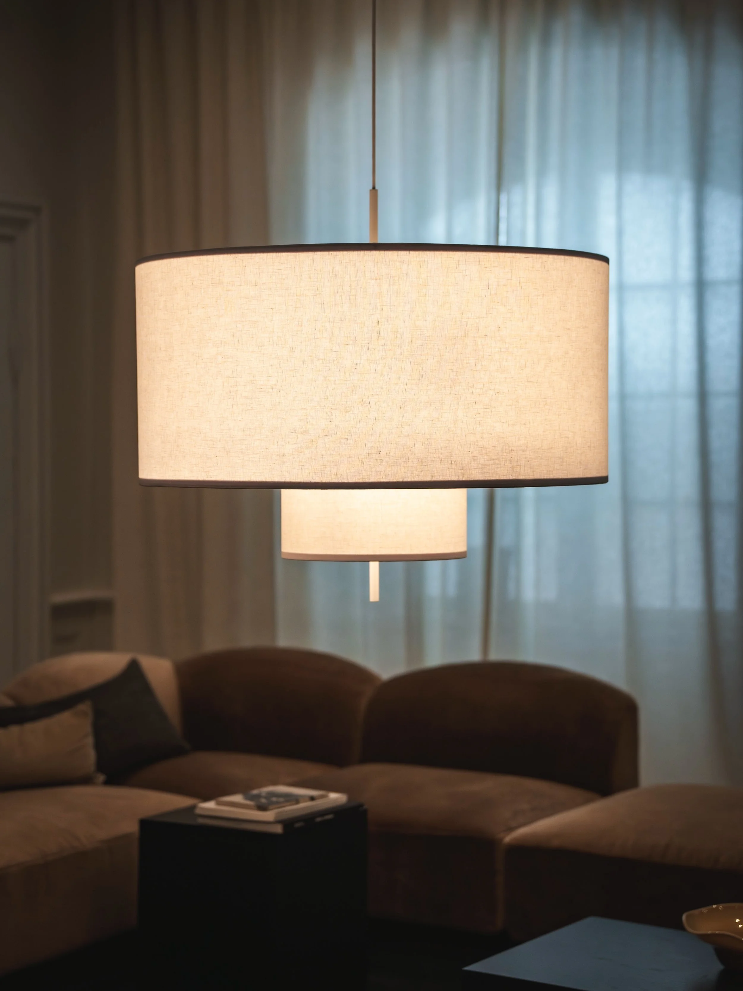 Designed by John Astbury, the margin lamp brings softness to a room. It&rsquo;s layered textile shade creates a warm and diffused glow without overpowering the architecture. #lighting #interiordesign #scandinavian