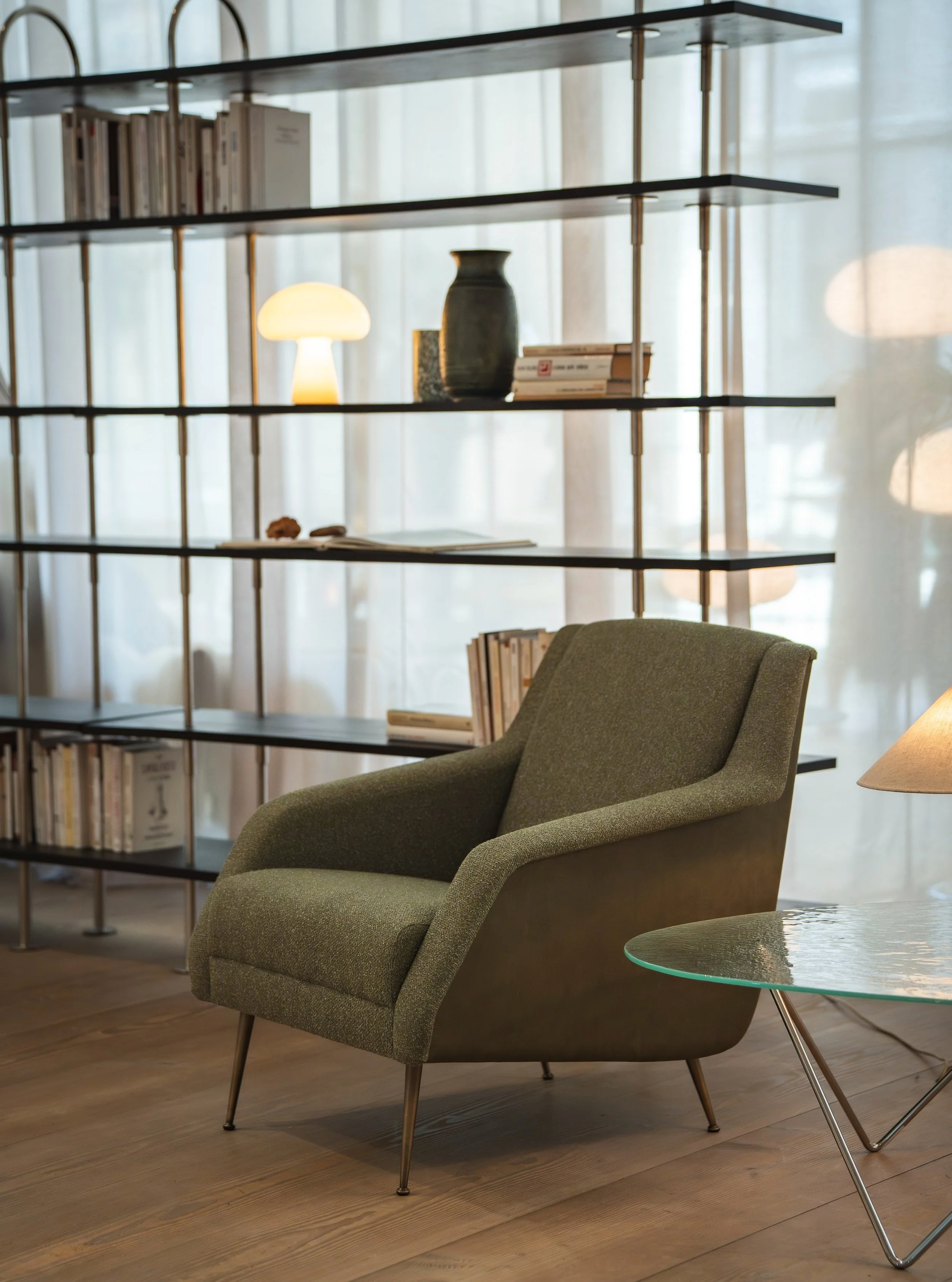 The GUBI CDC.1 Lounge Chair, designed by Carlo De Carli in 1954 is a timeless expression of Italian mid-century design. Its sculpted, wing-like arms, elegant proportions and distinctive conic legs give it a strong yet refined presence.

The muted oli