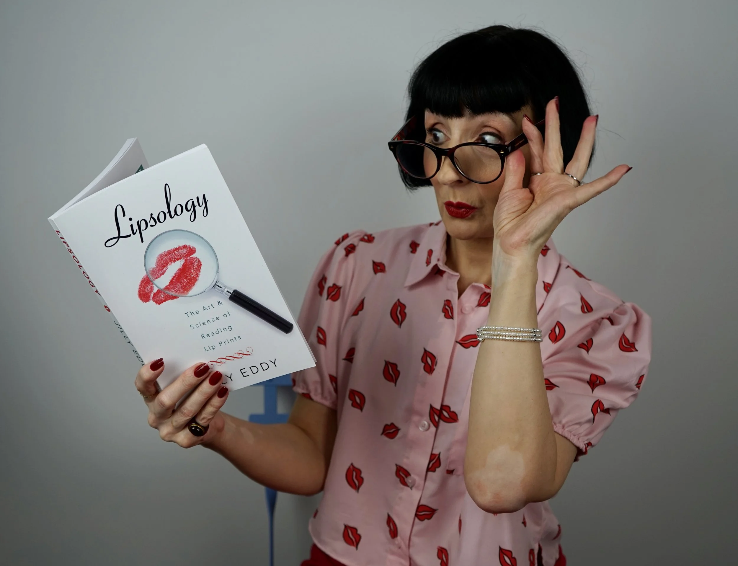 Ellie Velvet Lipsologist with book .jpeg