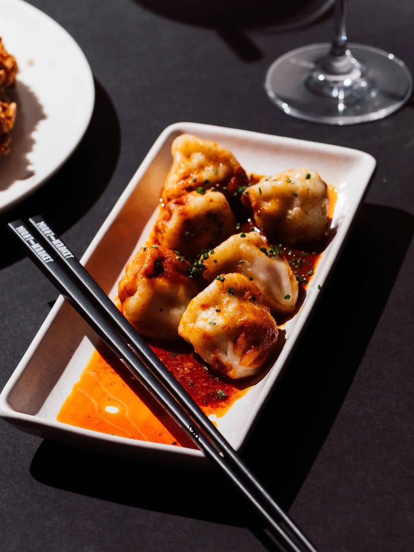 @nightmarketbrisbane 🥢 

Dine differently this weekend. ✨ 

Join us at Night Market for our signature Asian fusion flavours. From our Steamed Gyoza to Wagyu Skewers, every dish is crafted for sharing.
