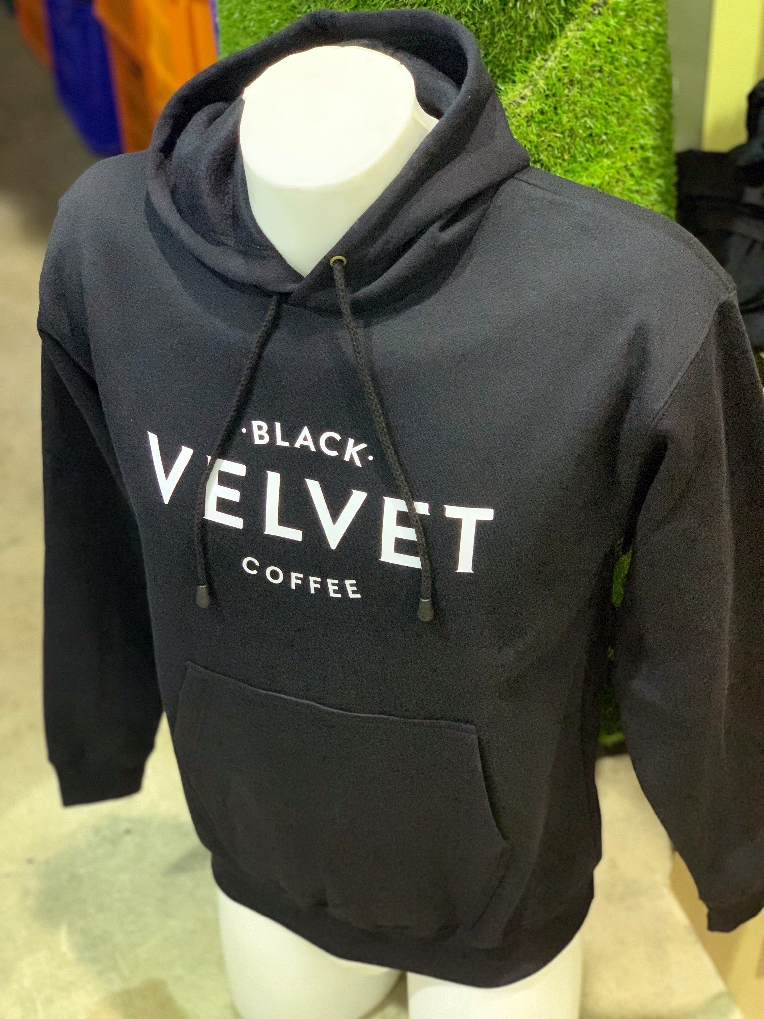 Custom printed cafe staff hoodies for Black Velvet Coffee Sydney with white logo on black hoodie