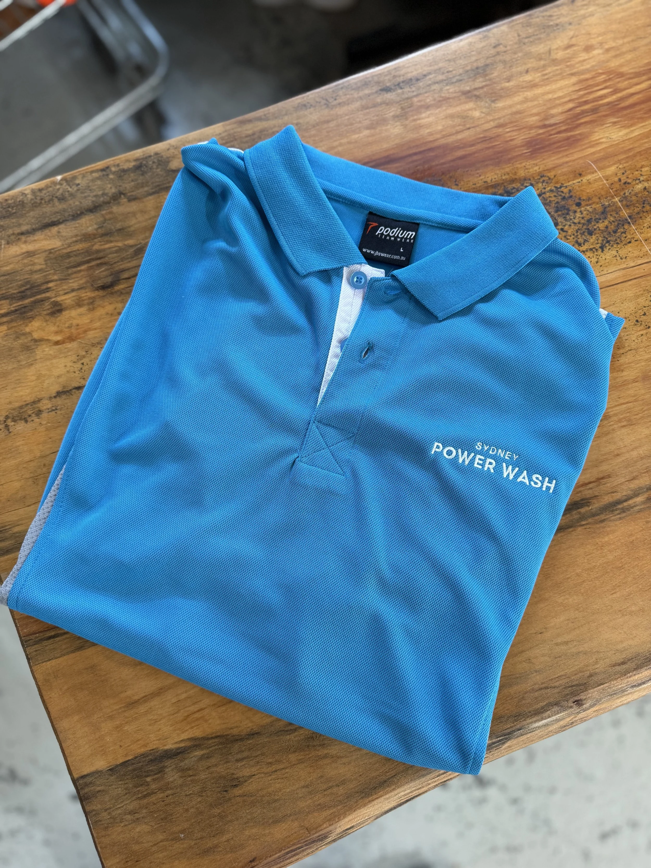 A folded blue polo shirt with 