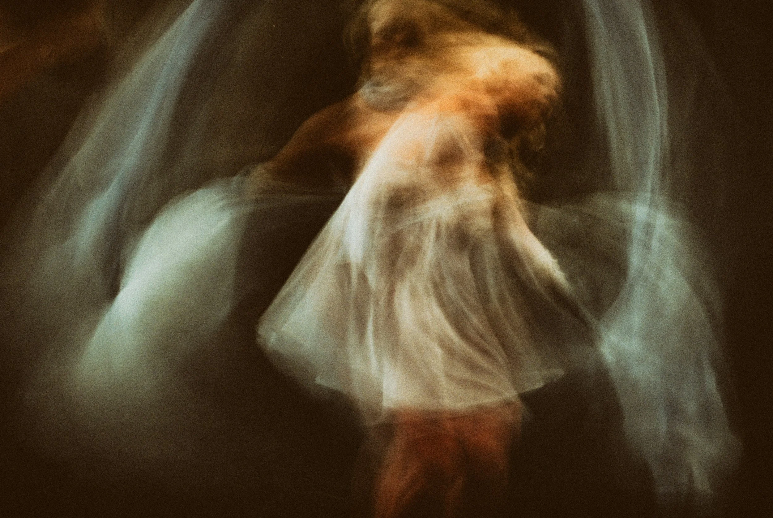 An ethereal image of a figure in flowing white garments, symbolising the supportive presence and gentle guidance that our spirit guides provide to us as we navigate life on earth.