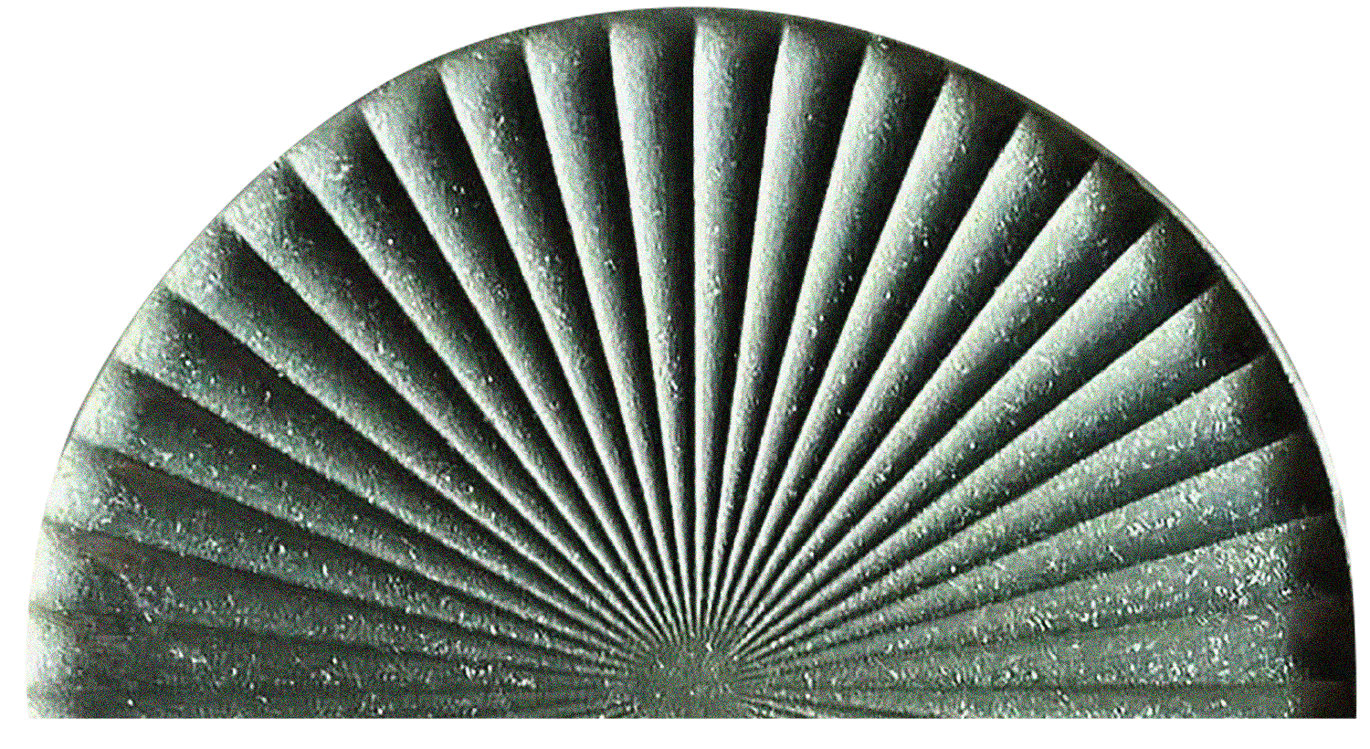 Close-up of a metallic, semi-circular fan with evenly spaced, detailed, textured blades radiating from a central point.