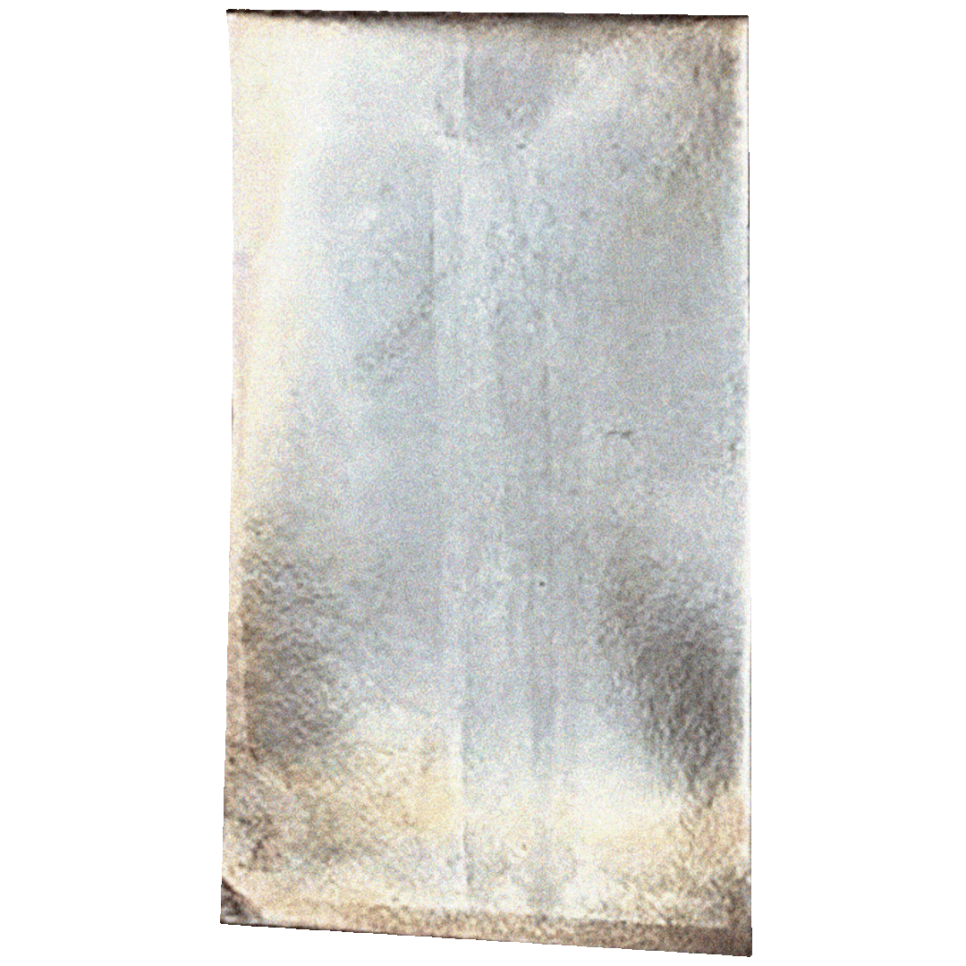 A textured, worn sheet of ice perched on a flat surface, with a slightly uneven surface and visible scratches or marks.