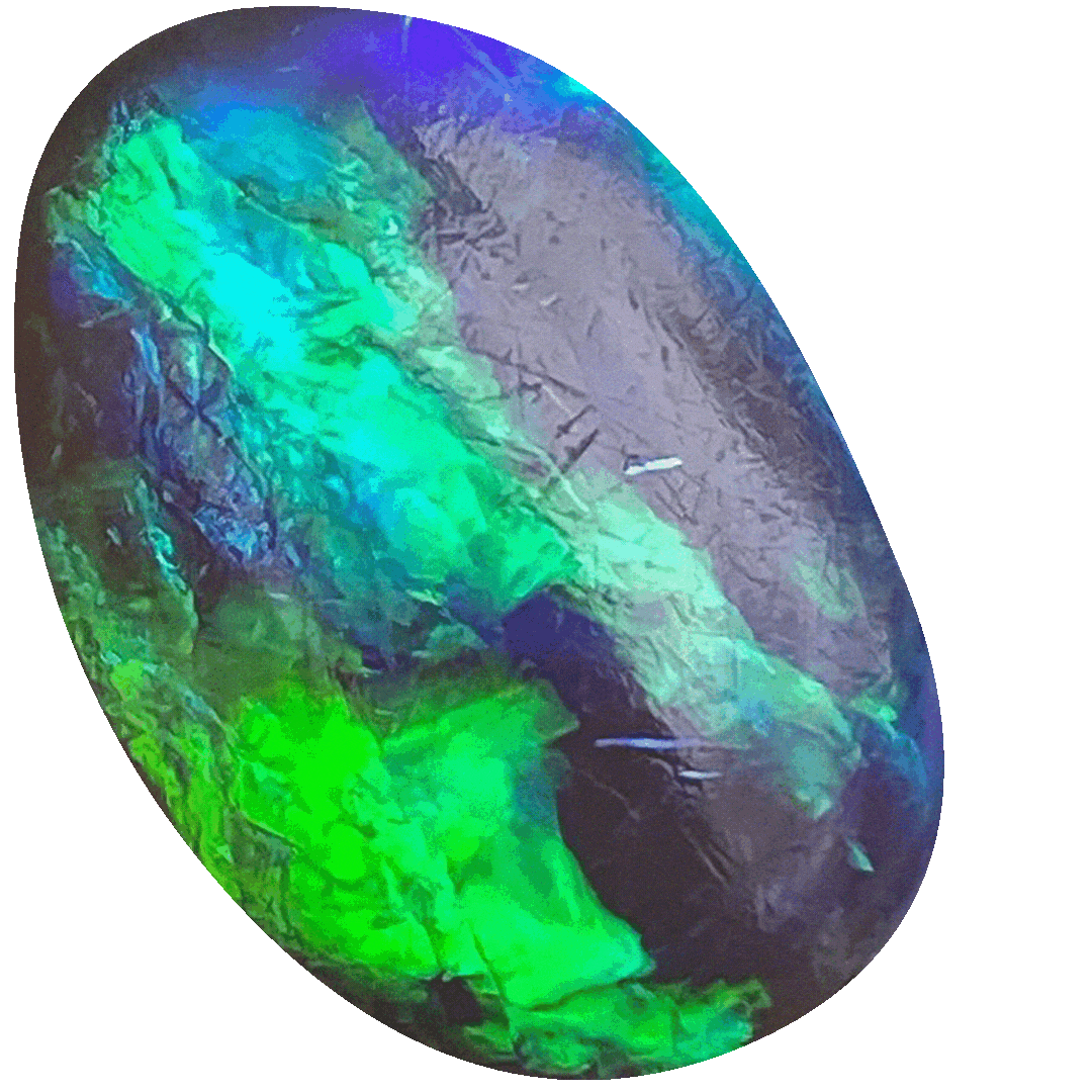Close-up of an iridescent black opal stone with vibrant green, blue, and purple colors.