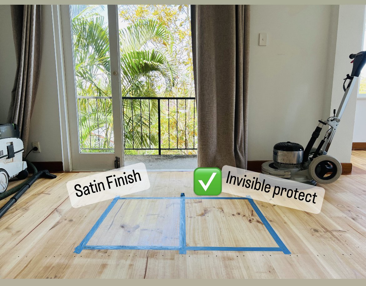 A room with a wooden floor, partially protected by blue painter's tape, with a door opening to a balcony with plants outside. Text overlays indicate satin finish and invisible protect, with a green checkmark.