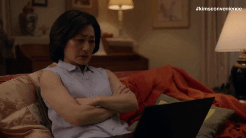 Why is my website NOT showing up on Google search - woman sitting on couch refreshing computer