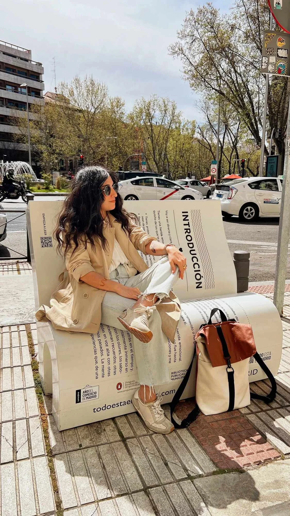Elizabeth Quintal web designer sitting on bench shaped like a book