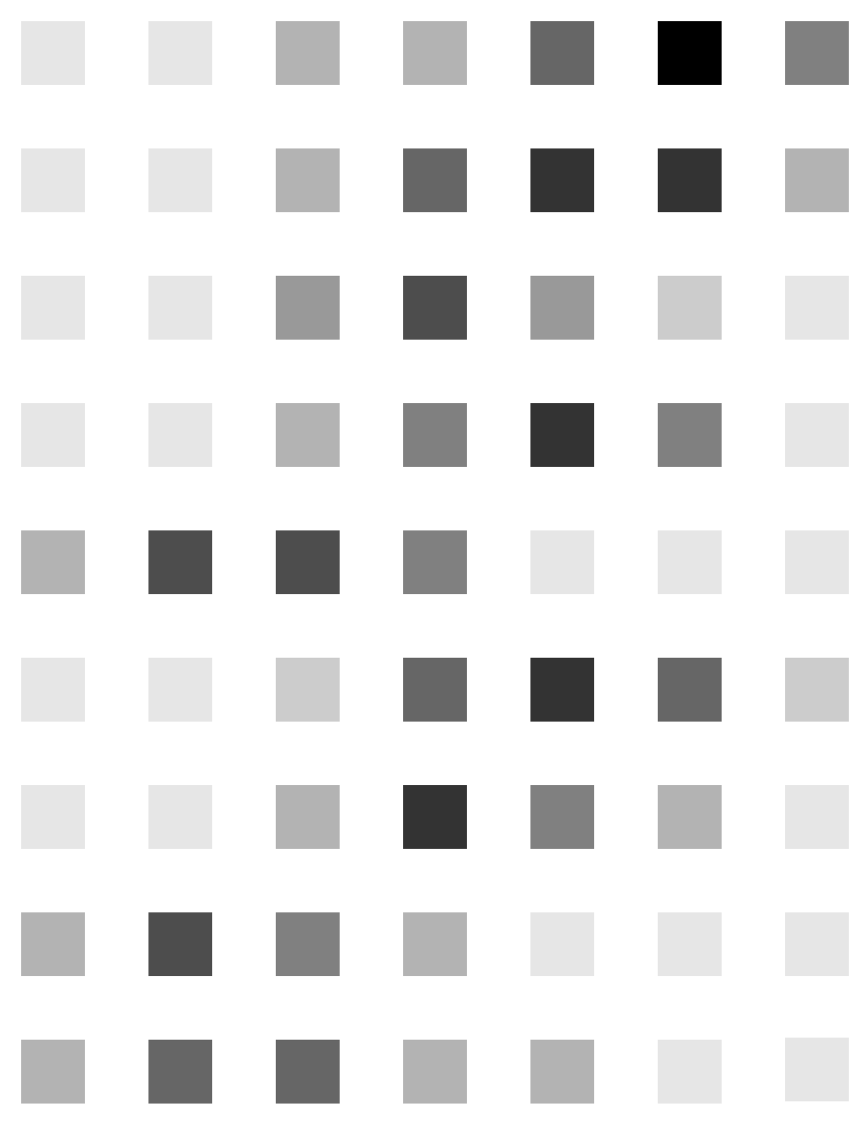 An Ishihara color vision test sheet with multiple gray and black dotted circles containing numbers and patterns.