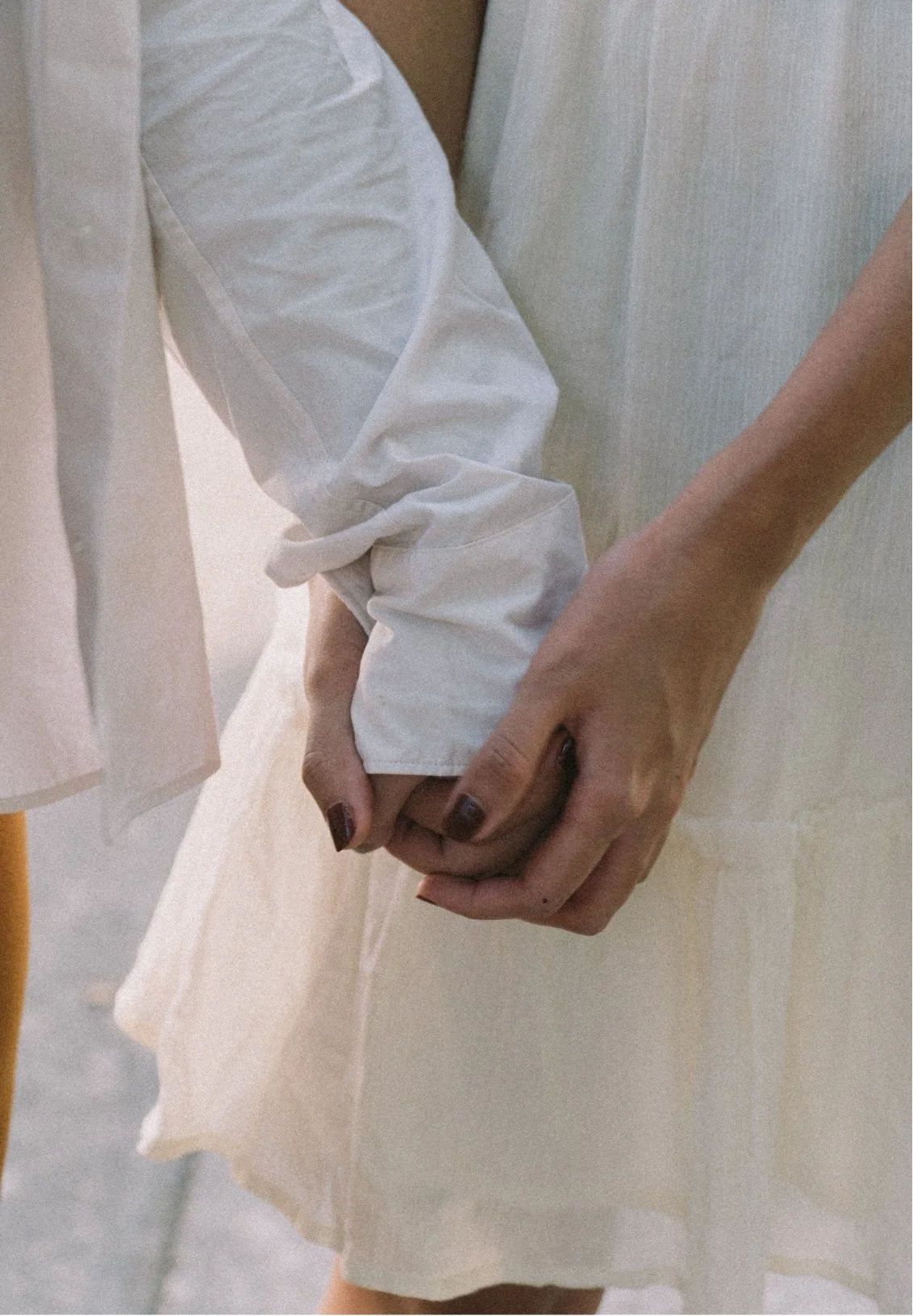a couple holding hands in summer clothes, representing couples therapy in Florida