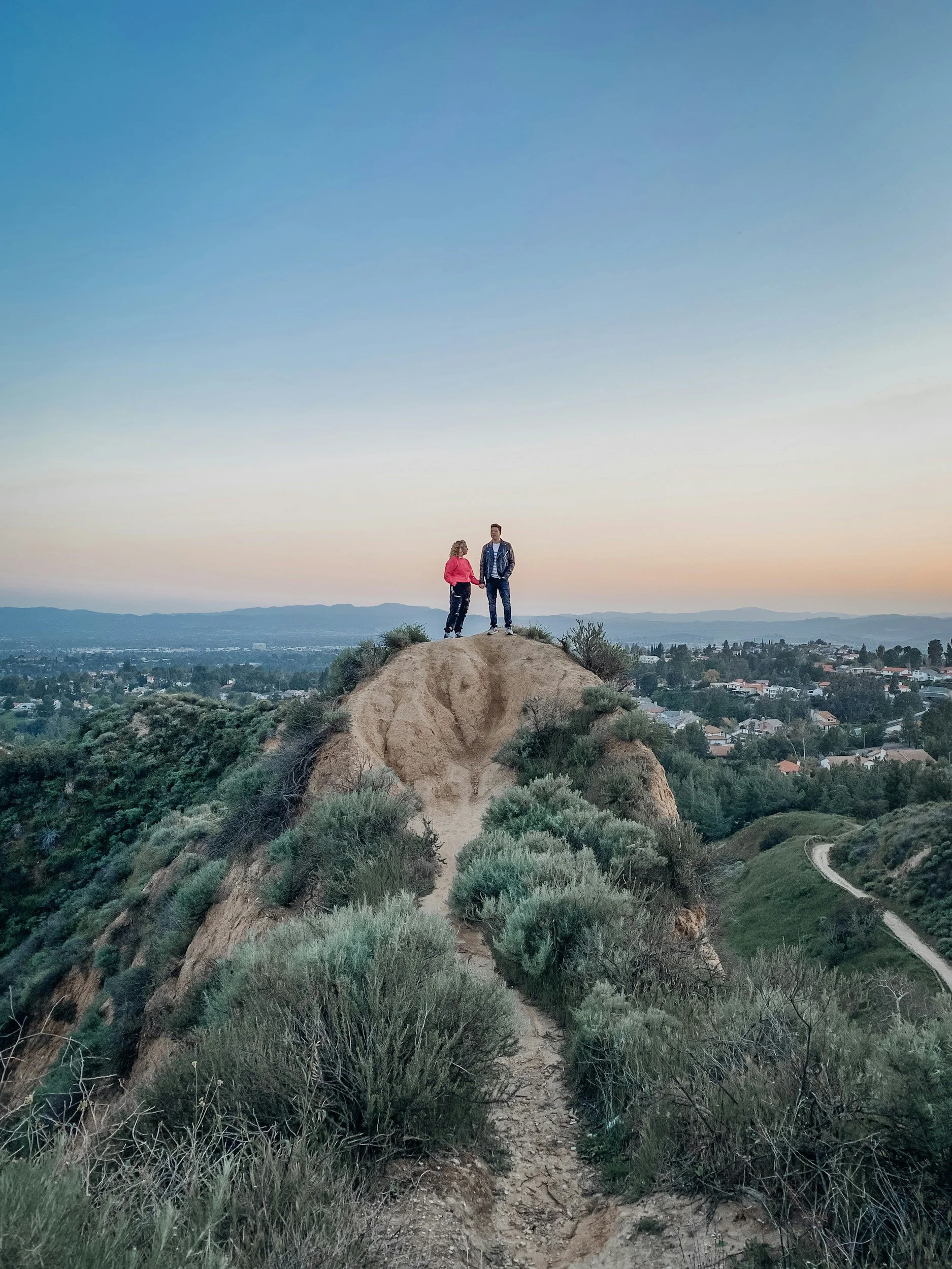 a couple is standing on a hill during a hike in Los Angeles, symbolizing a healthy relationship as a result of couples therapy