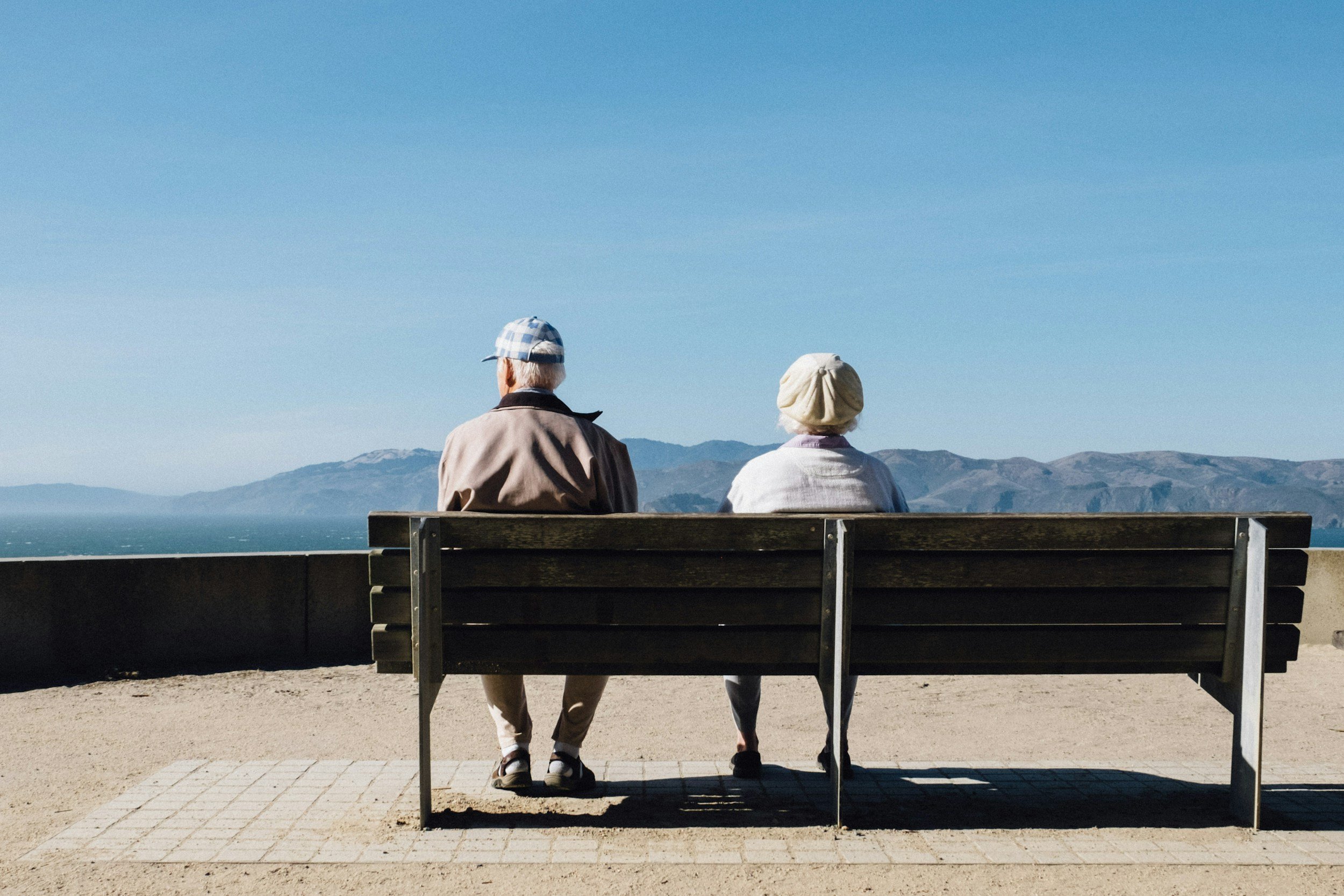 Couple sitting together but emotionally distant, representing misunderstanding and unmet expectations in relationships
