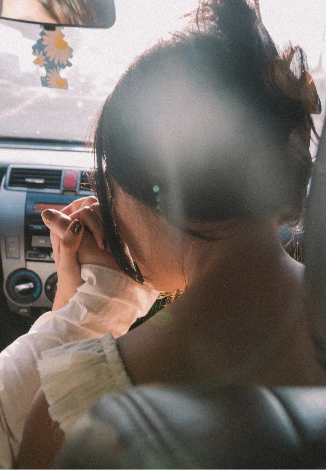 a couple in love, sitting in the car together, holding hands, symbolizing a healthy relationship